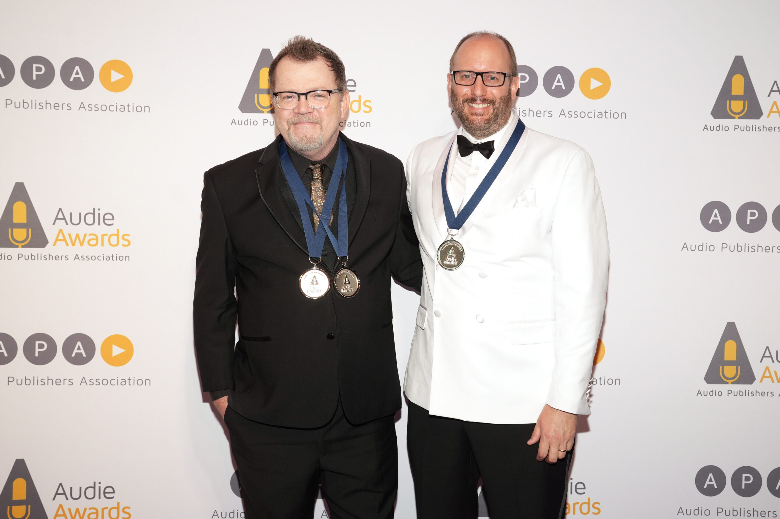 NEW YORK, NEW YORK - MARCH 28: Scott Brick and Landon Beach (R) attend the Audio Publishers Association's 2023 Audie Awards at Pier 60, Chelsea Piers on March 28, 2023 in New York City. (Photo by Ilya S. Savenok/Getty Images for Audio Publishers Association)
