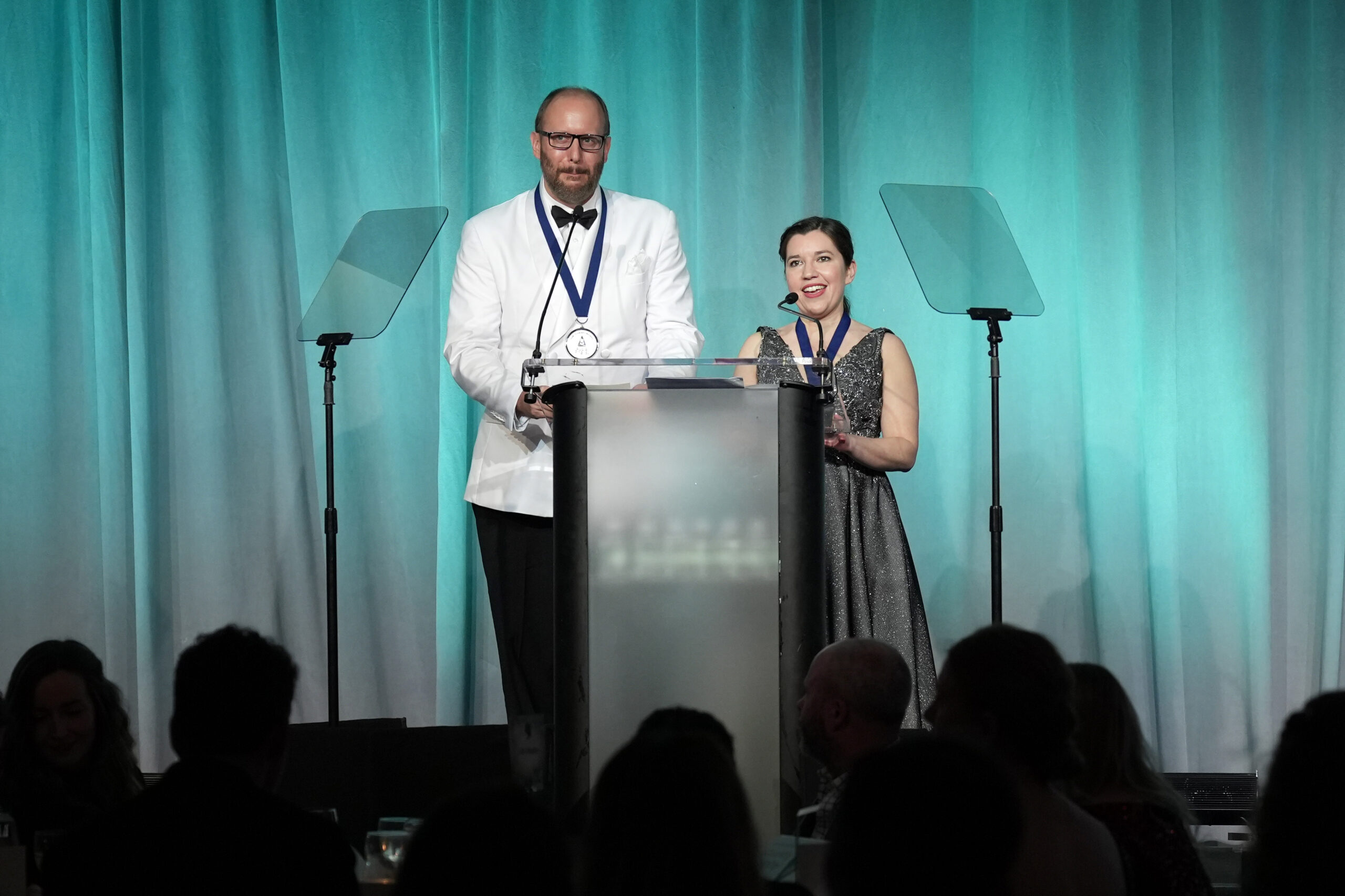NEW YORK, NEW YORK - MARCH 28: Landon Beach and Hope Newhouse speak onstage during the Audio Publishers Association's 2023 Audie Awards at Pier 60, Chelsea Piers on March 28, 2023 in New York City. (Photo by Ilya S. Savenok/Getty Images for Audio Publishers Association)